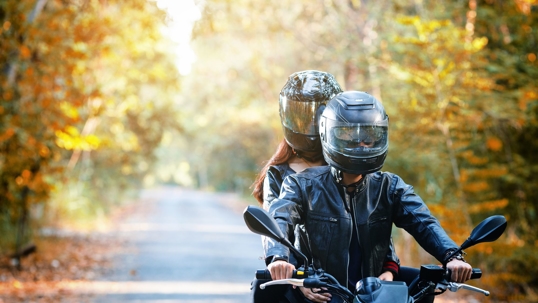 Man and Woman Riding Motorcycle